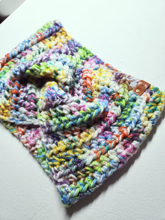 Multicolored crocheted blanket on a white surface