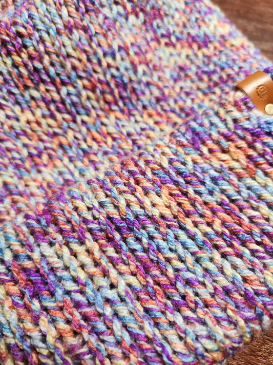 Close-up of multicolored yarn on a wooden surface