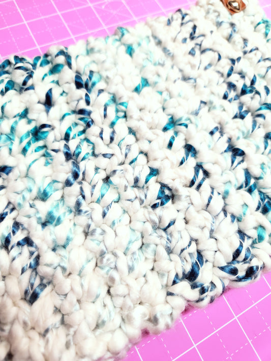 Textured white and blue fabric on a pink grid background