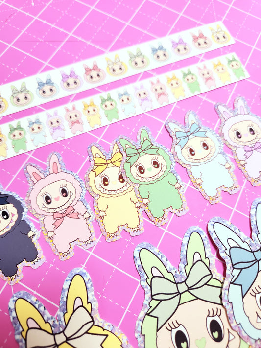 Cartoon animal stickers on a pink grid background