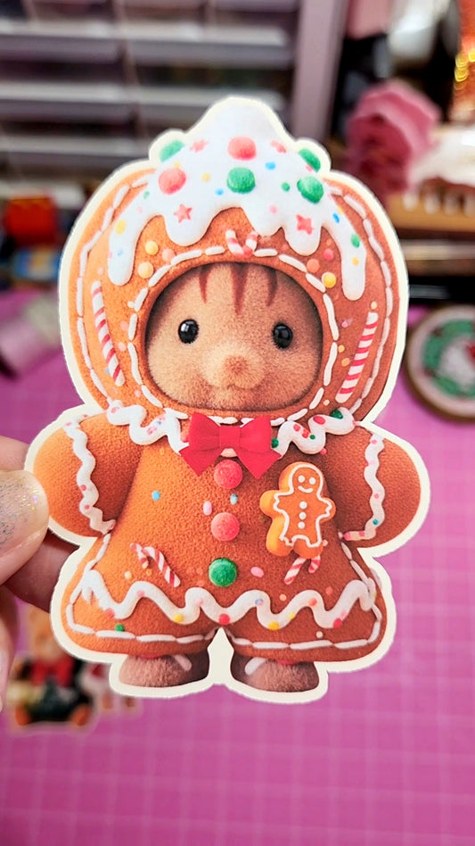 Gingerbread-themed plush toy with a pink background