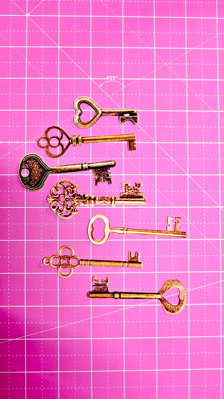 Vintage keys on a pink grid background