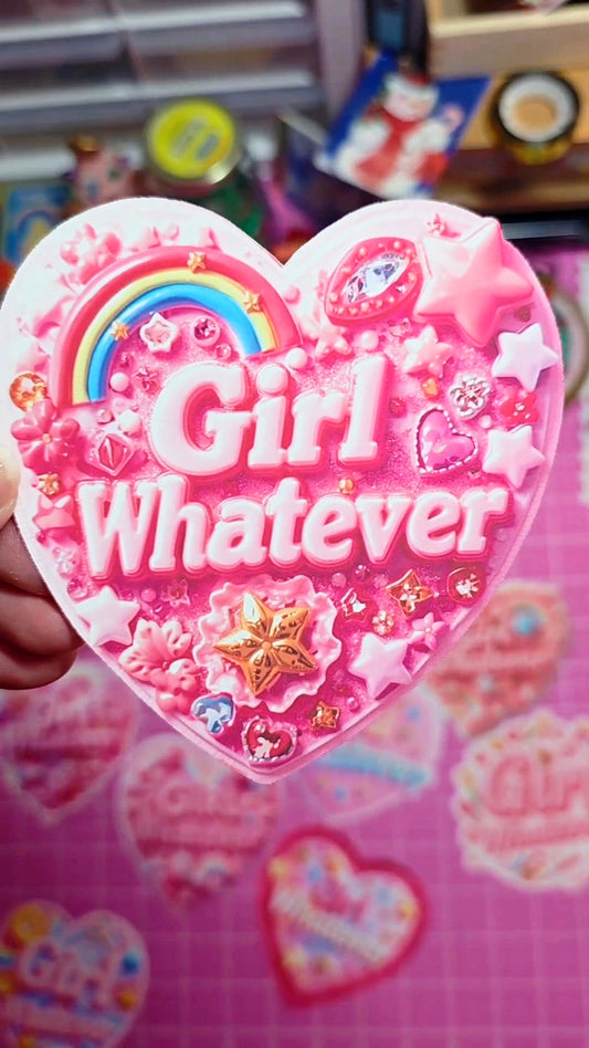 Heart-shaped pink object with 'Girl Whatever' text and decorative elements on a pink background.