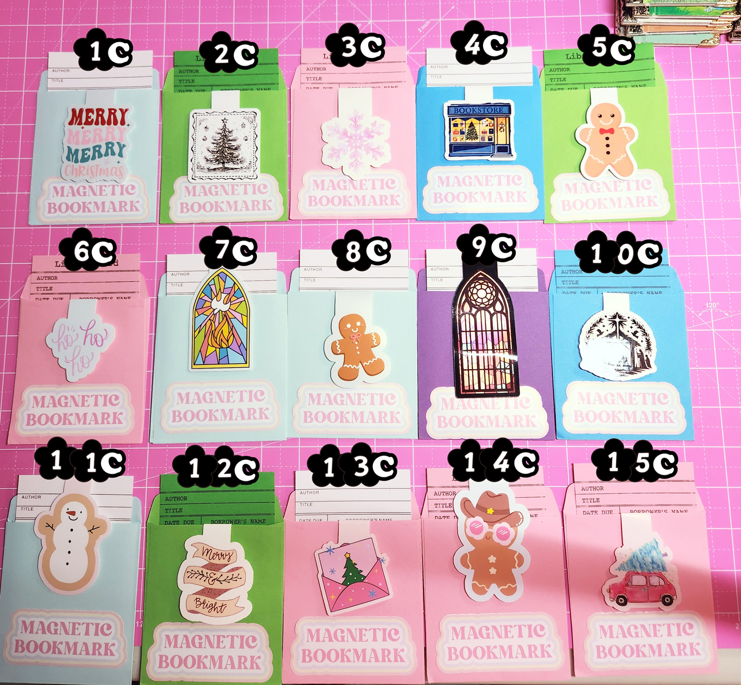 Set of magnetic bookmarks with various designs on a pink grid background