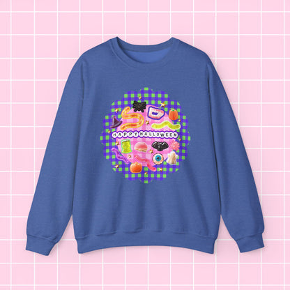 A blue crewneck sweatshirt featuring a colorful retro-style graphic with the text 'HAPPY MOTHER'S DAY' and various cute food and toy illustrations, displayed on a pink grid background.