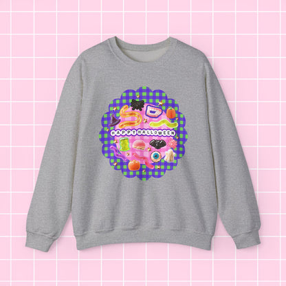 A heather gray crewneck sweatshirt featuring a colorful retro-style graphic print on the front with a purple and green gingham circle, retro illustrations, and the text 'GREAT TIMES!!!' in white bubble letters, displayed against a pink grid background.