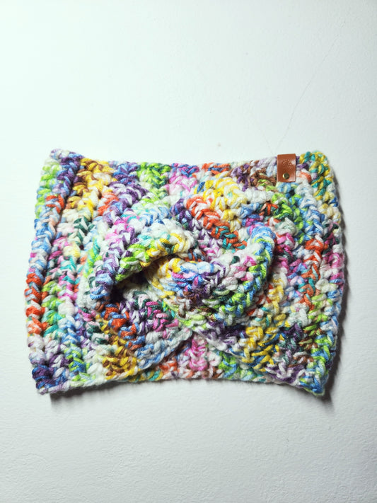 Colorful crocheted hat on a light gray background