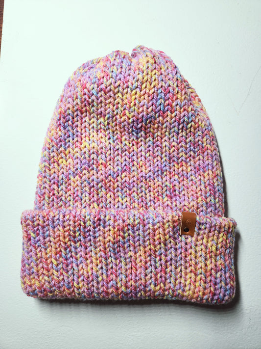 Multicolored knit beanie on a light gray background