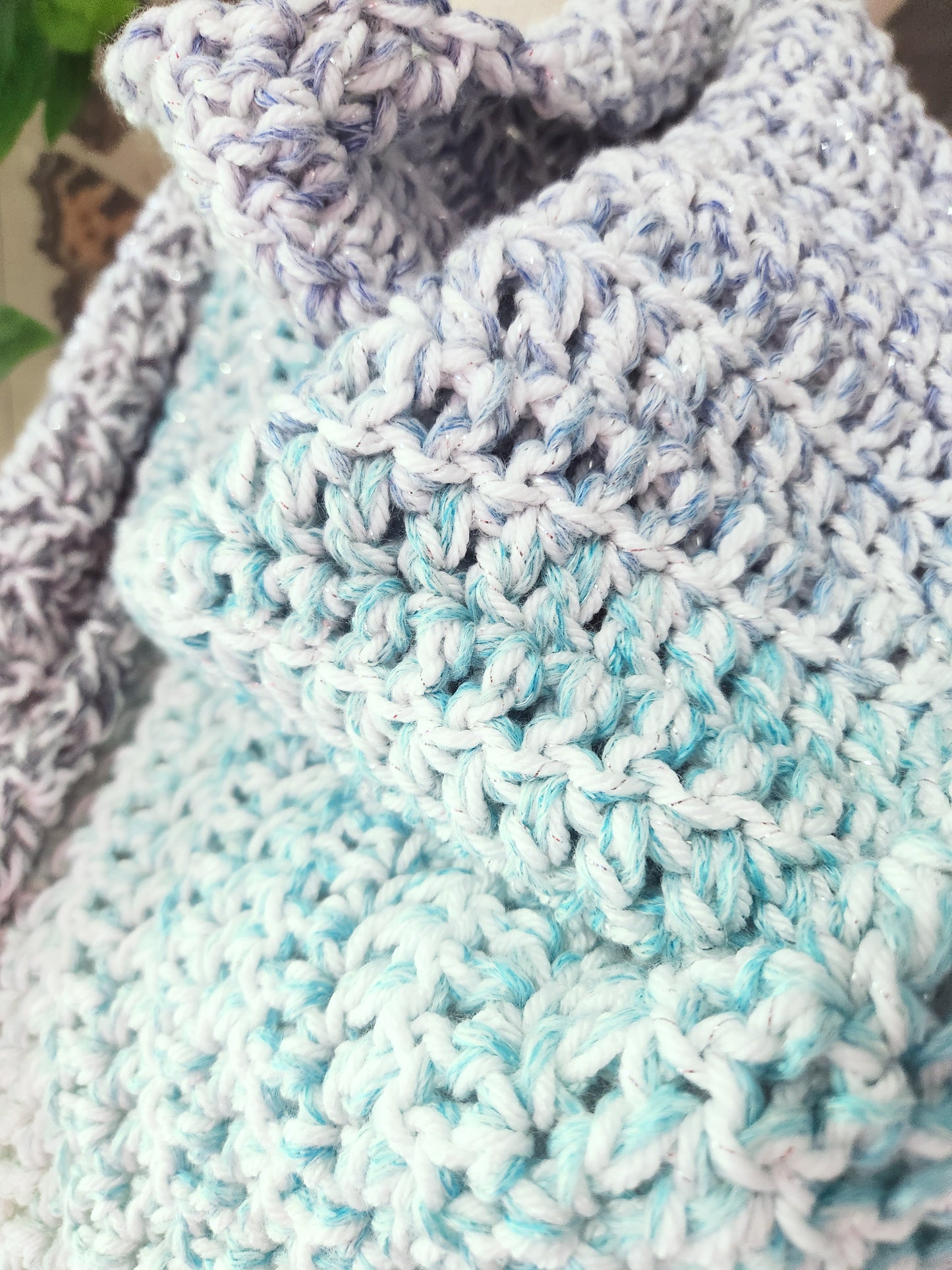 Close-up of a crocheted blanket with blue and gray pattern
