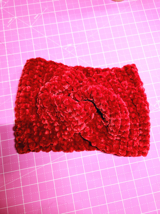 Red knitted fabric on a pink grid background