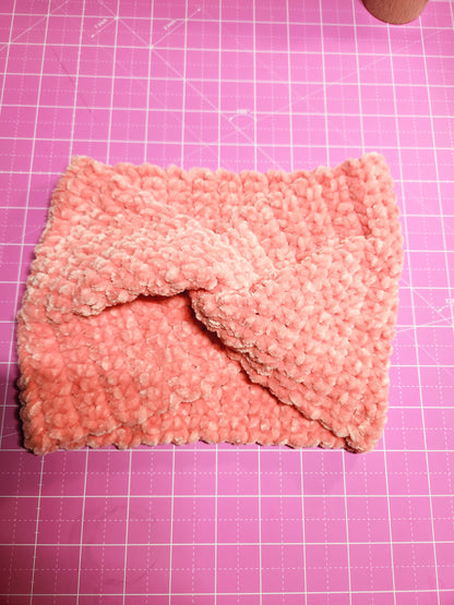 Pink textured fabric on a pink grid background