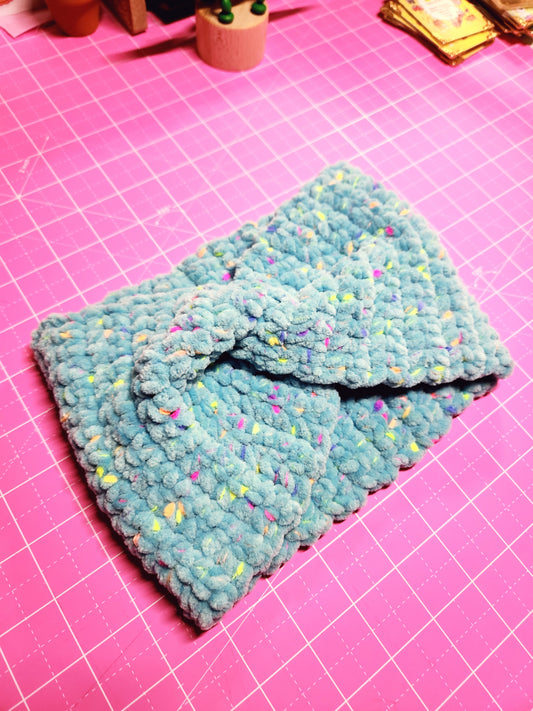 Blue textured fabric on a pink grid background