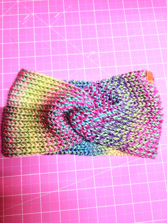 Colorful knitted fabric on a pink grid background