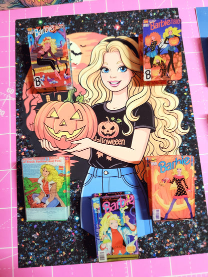Barbie Halloween-themed books on a pink cutting mat