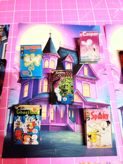 Halloween-themed board game box with colorful graphics on a pink grid background