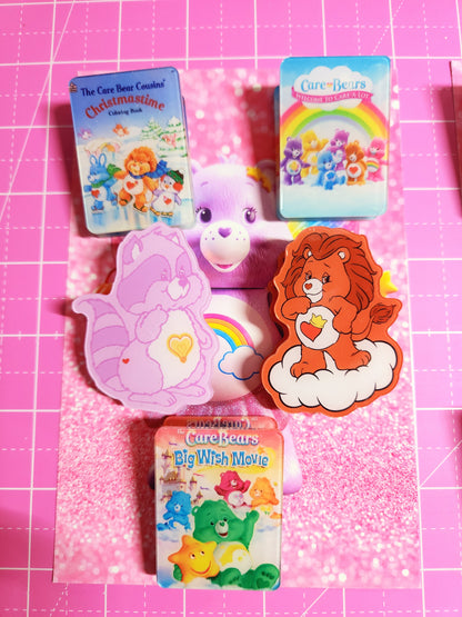Cartoon character-themed erasers on a pink grid background