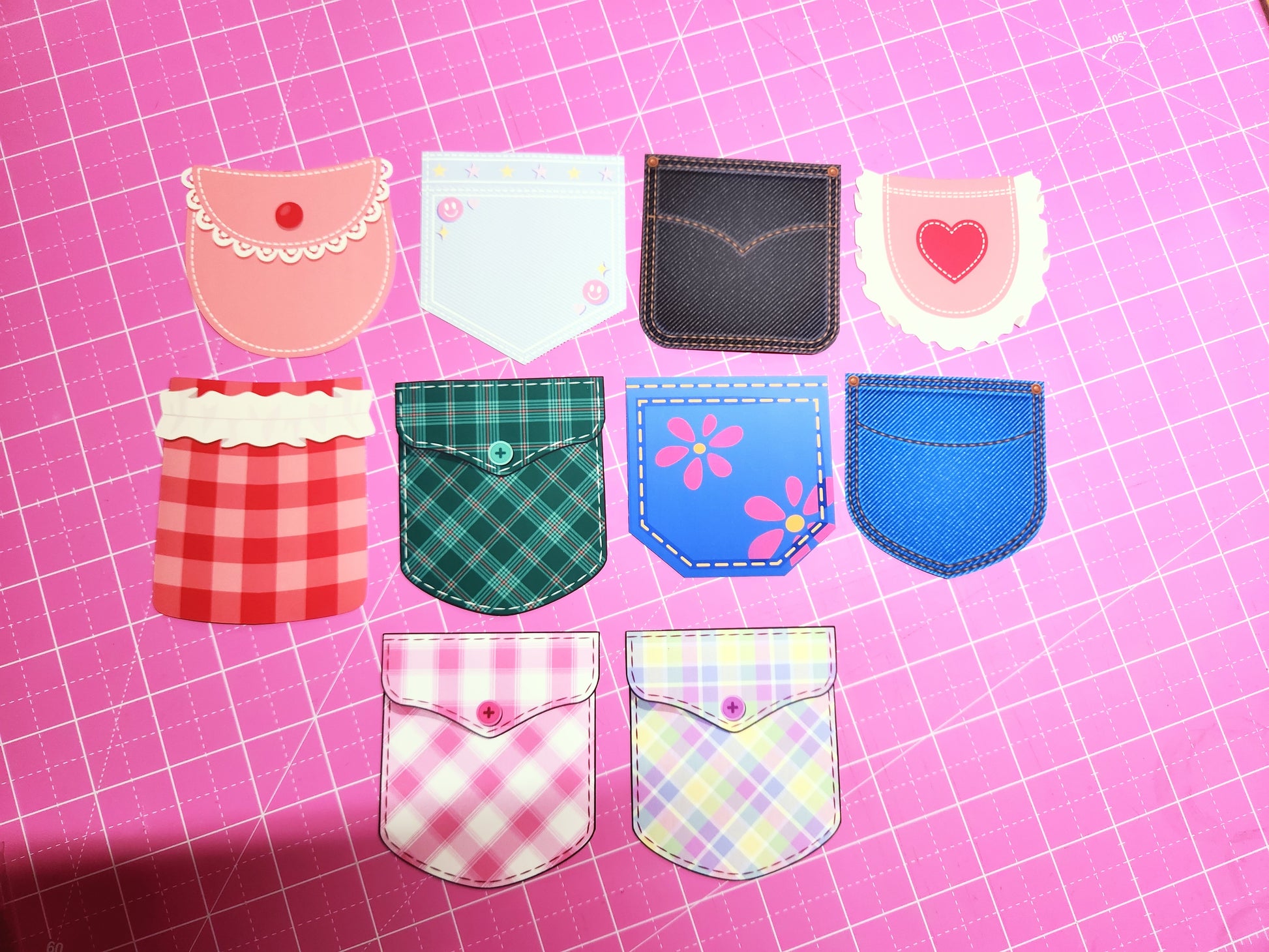 Collection of colorful fabric pockets on a pink grid background