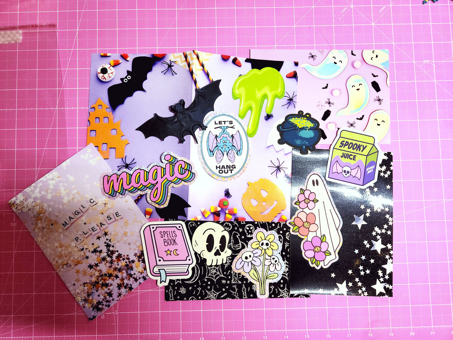 Halloween-themed stickers on a pink cutting mat