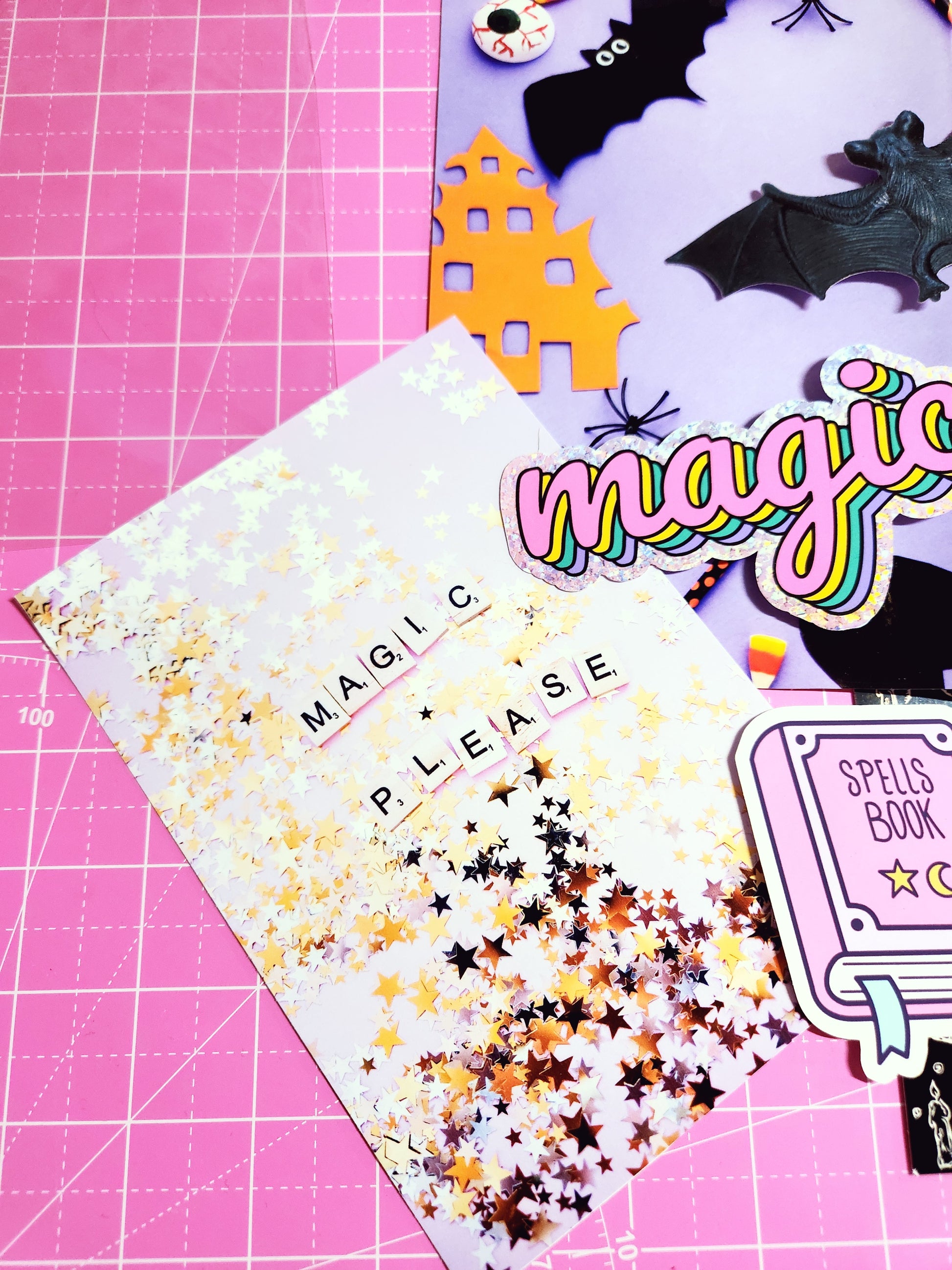 Sheet of decorative stickers with text and confetti on a pink cutting mat.