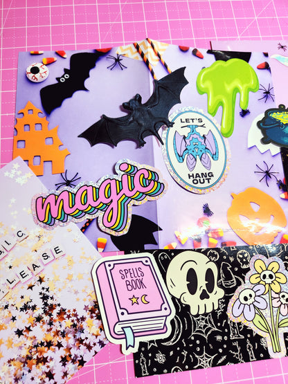 Collection of colorful Halloween-themed stickers on a pink background