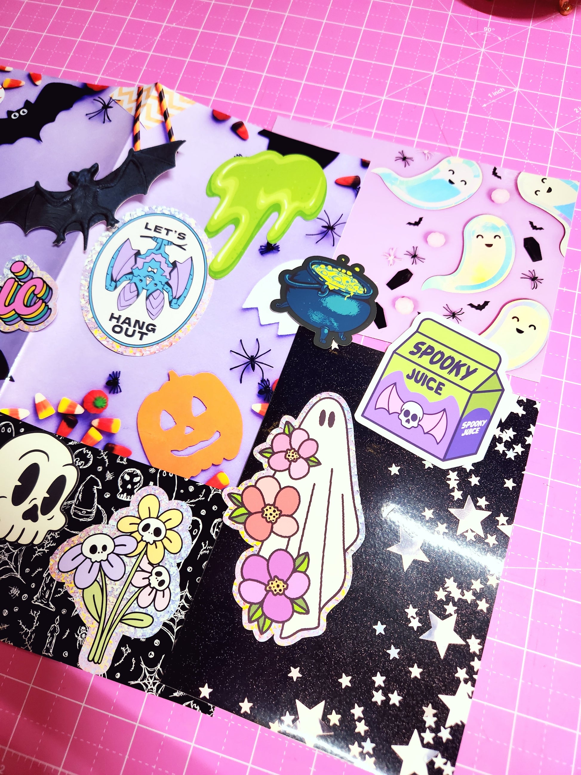 Collection of colorful stickers on a pink grid background