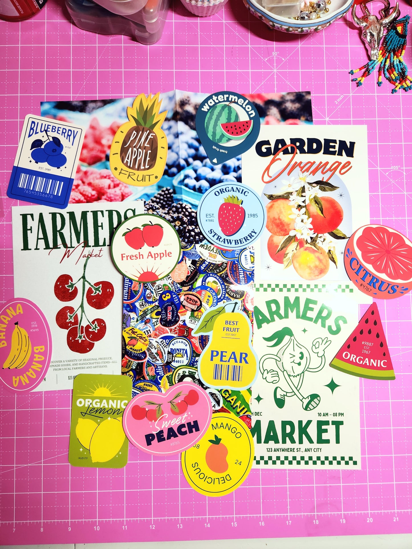 Collection of colorful stickers on a pink cutting mat