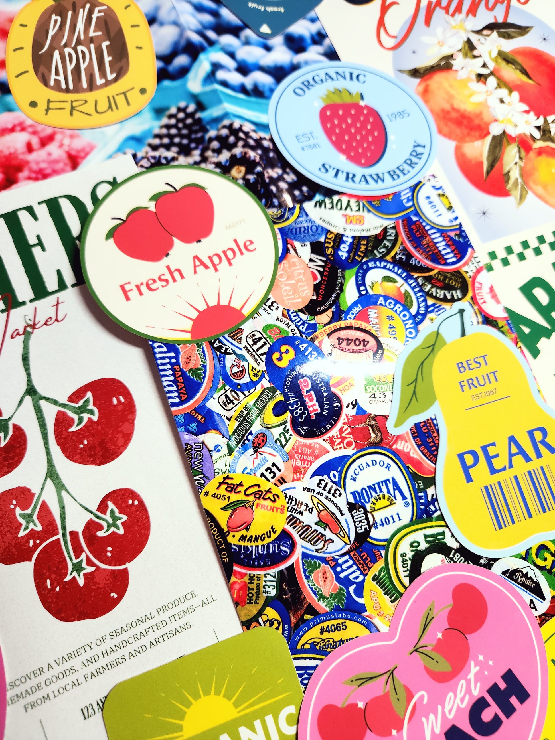 Collection of colorful fruit-themed stickers on a magazine page.
