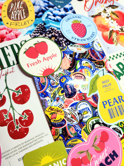 Collection of colorful fruit-themed stickers on a magazine page.
