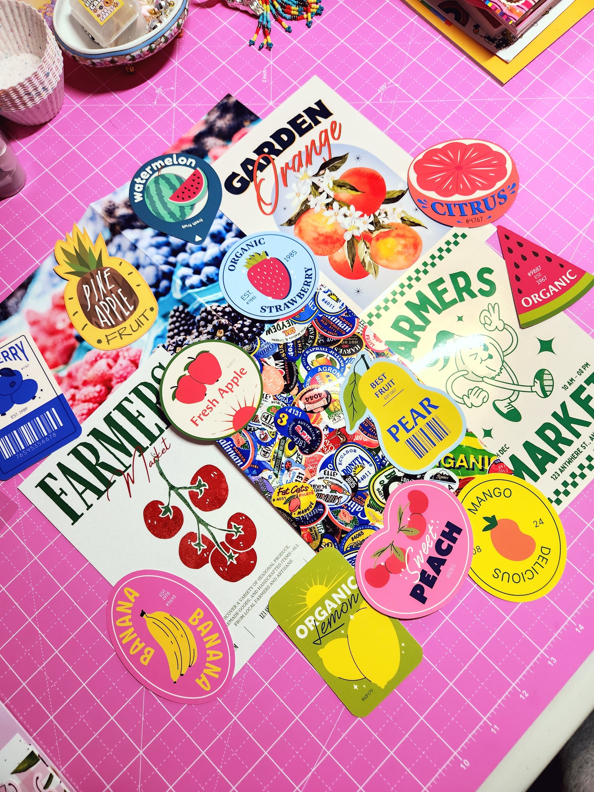 Collection of colorful stickers on a pink cutting mat