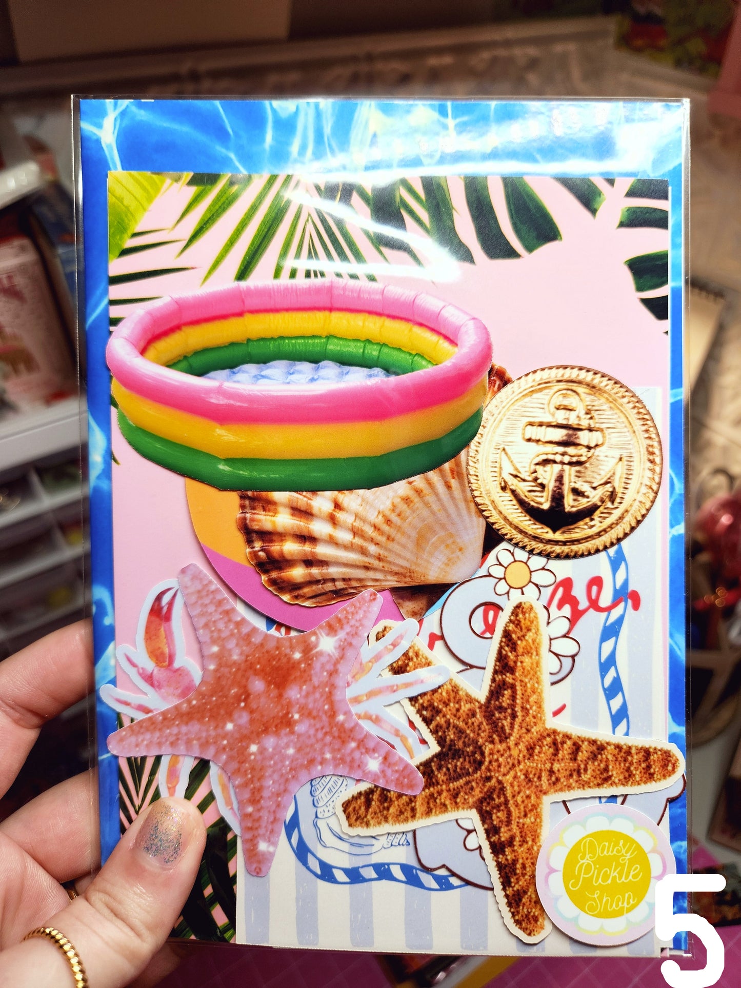 Colorful hair accessories with starfish and shell designs on a decorative box.