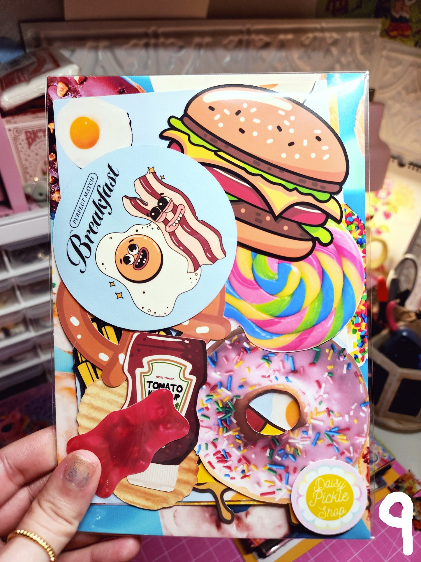 Colorful product packaging with cartoon food illustrations held by a hand.