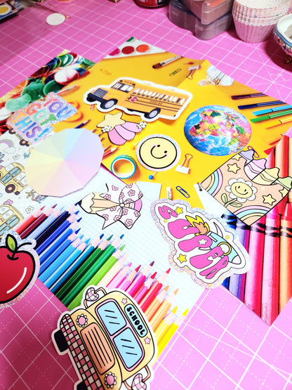 Colorful stationery items including stickers and markers on a pink grid background