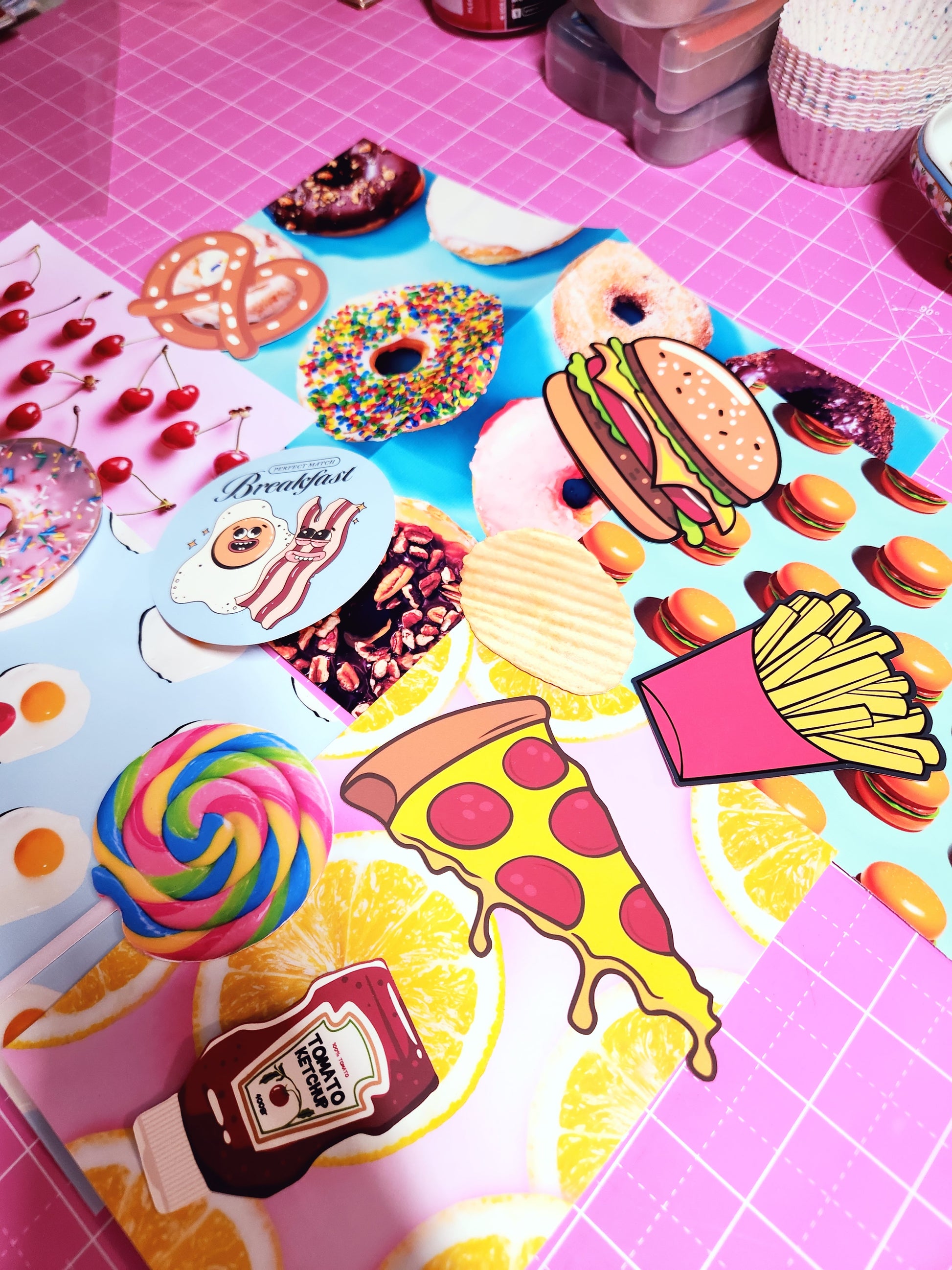 Colorful food-themed stickers on a pink grid background
