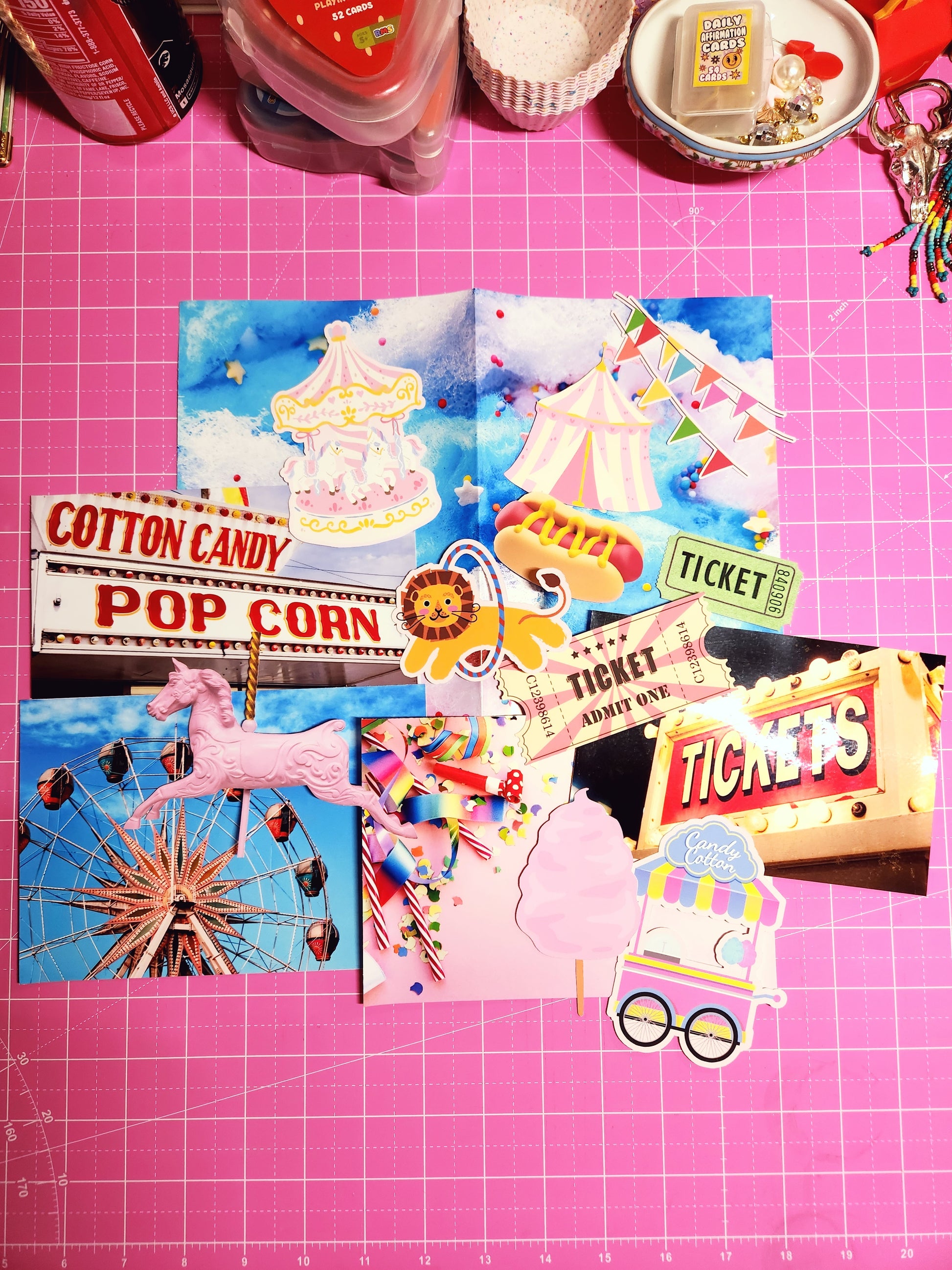Colorful carnival-themed cutout decorations on a pink grid background