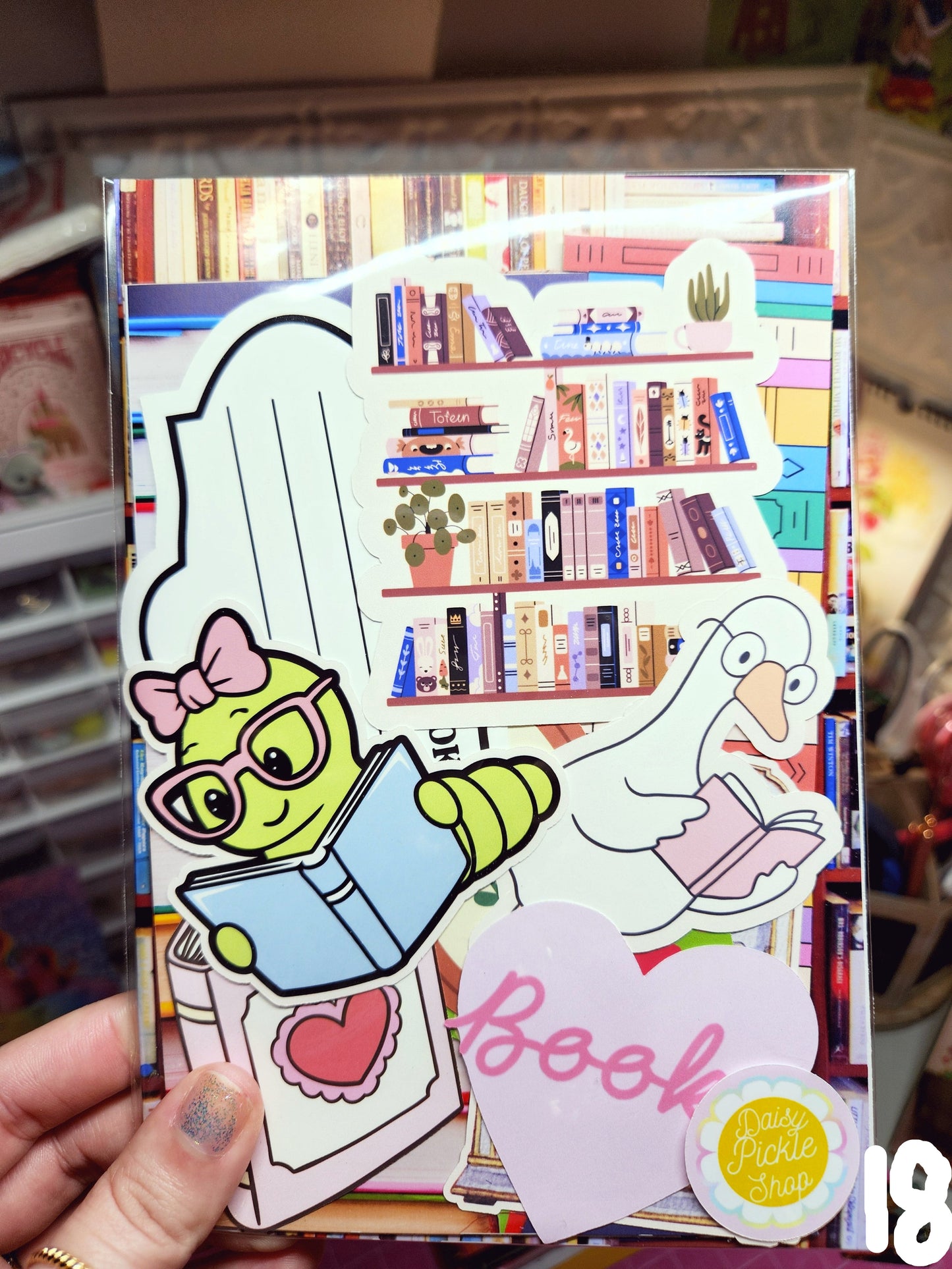 Colorful book with stickers and a hand holding it
