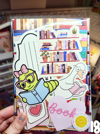 Colorful book with stickers and a hand holding it