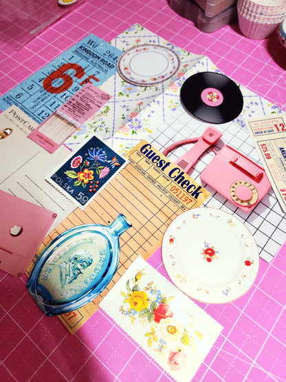 Collection of vintage items including a vinyl record, tickets, and a guest check on a pink surface with grid lines.