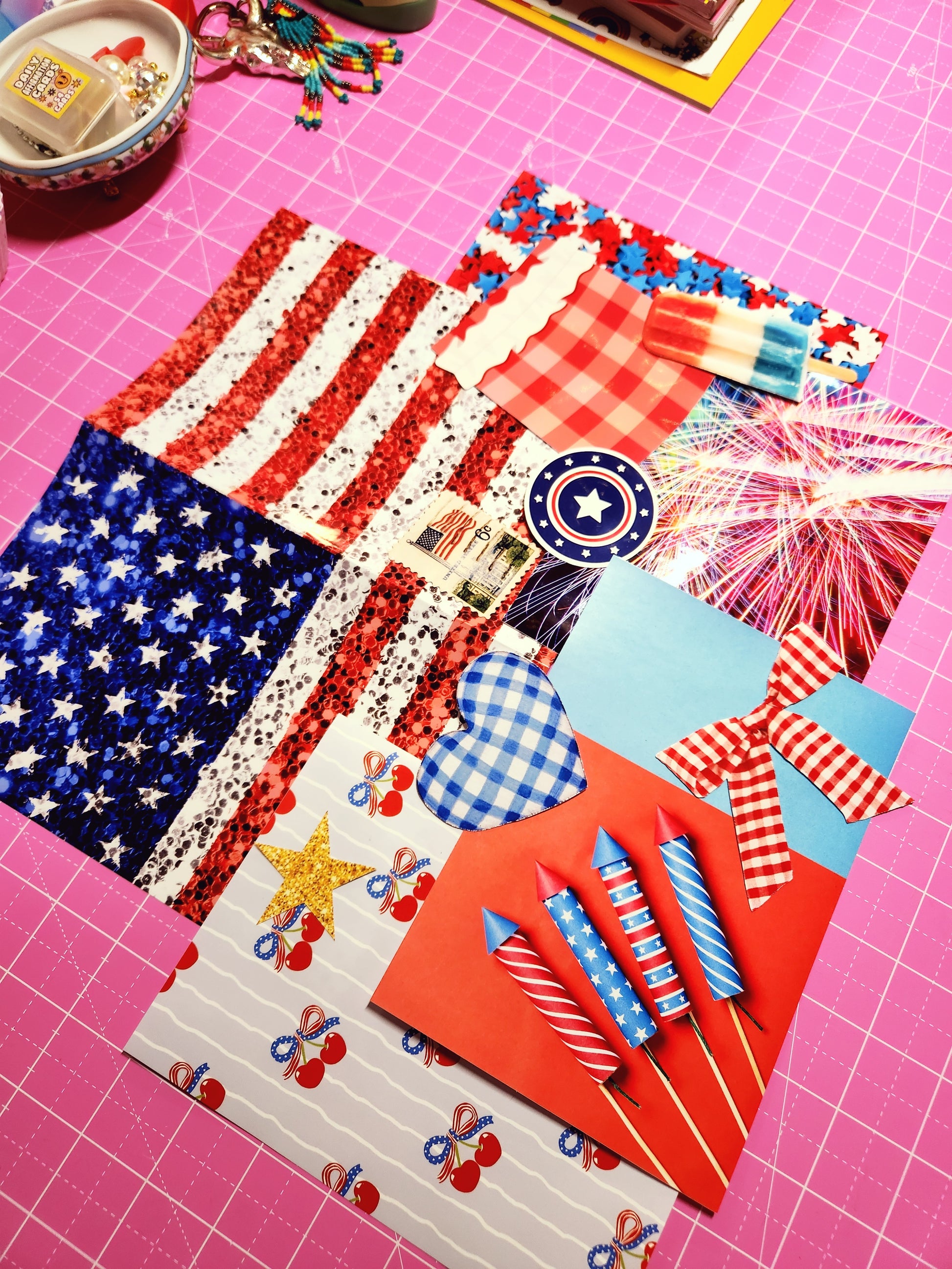 Collection of patriotic-themed items on a pink cutting mat