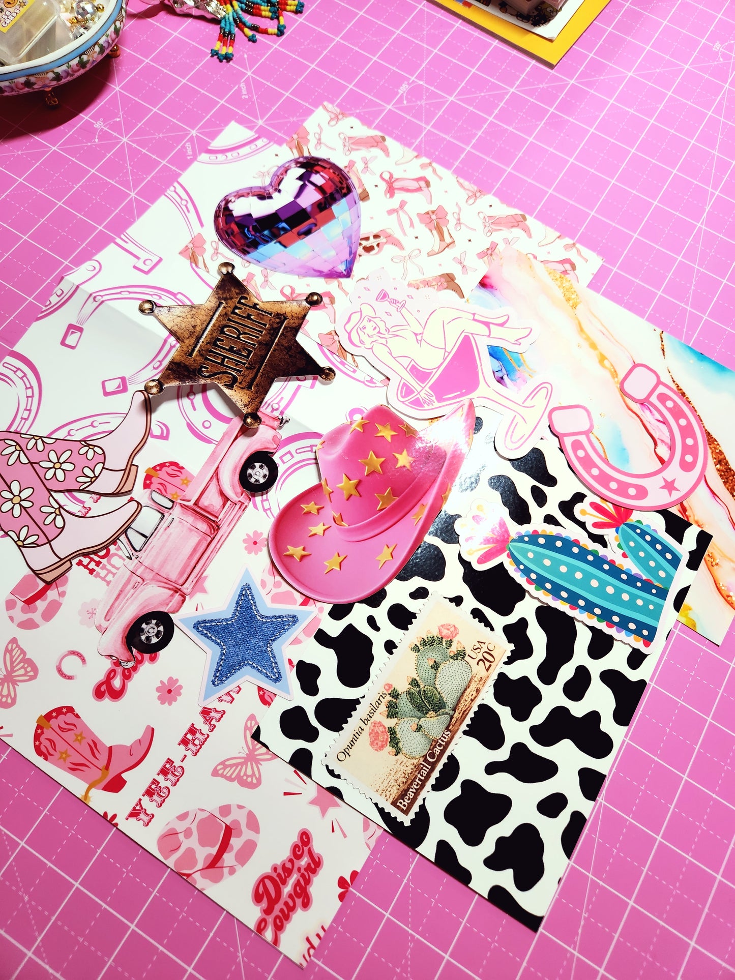 Collection of colorful stickers on a pink cutting mat