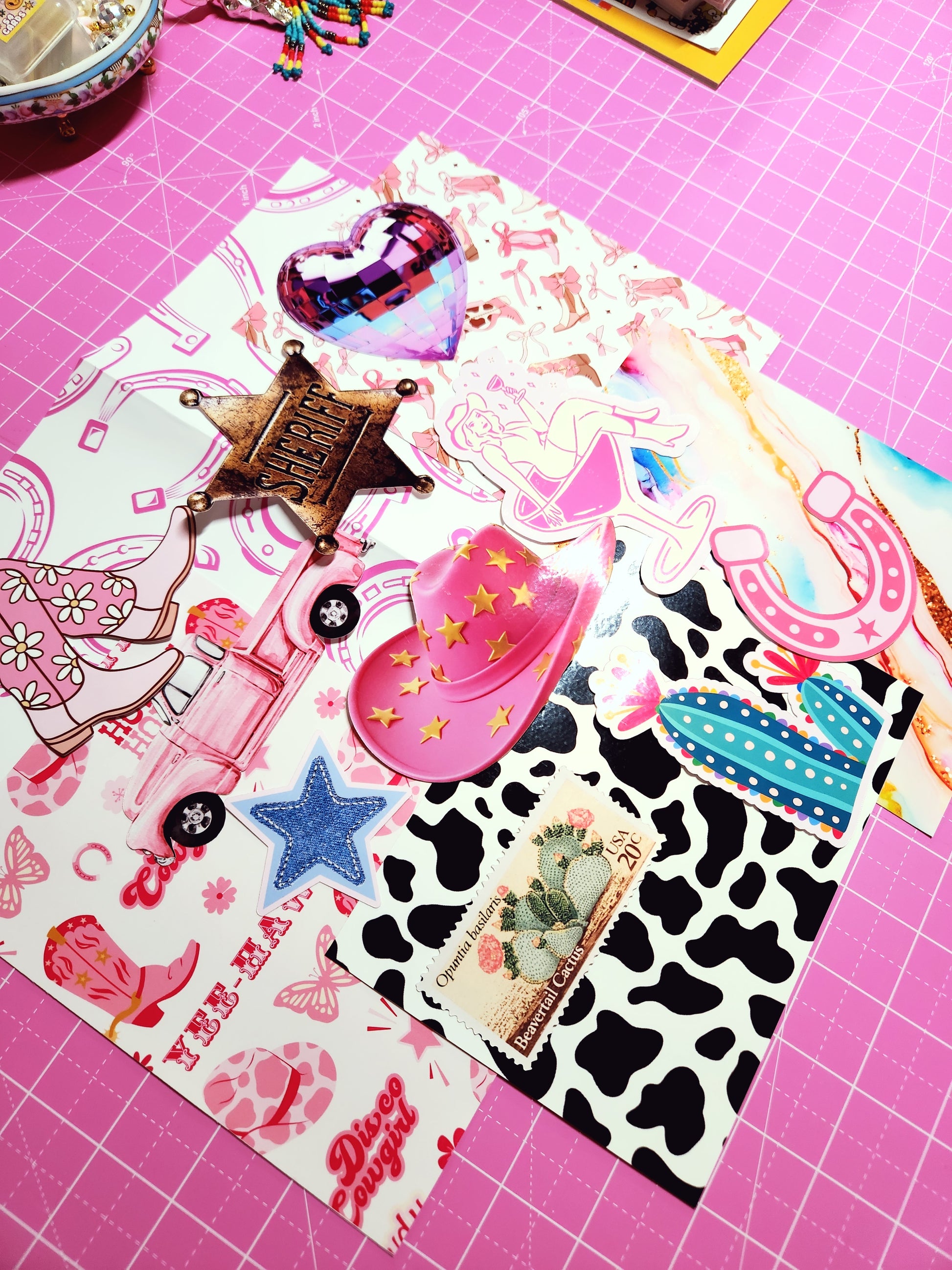 Collection of colorful stickers on a pink cutting mat