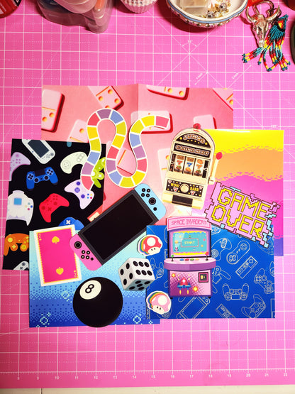 Colorful game-themed phone case on a pink cutting mat with gaming elements.