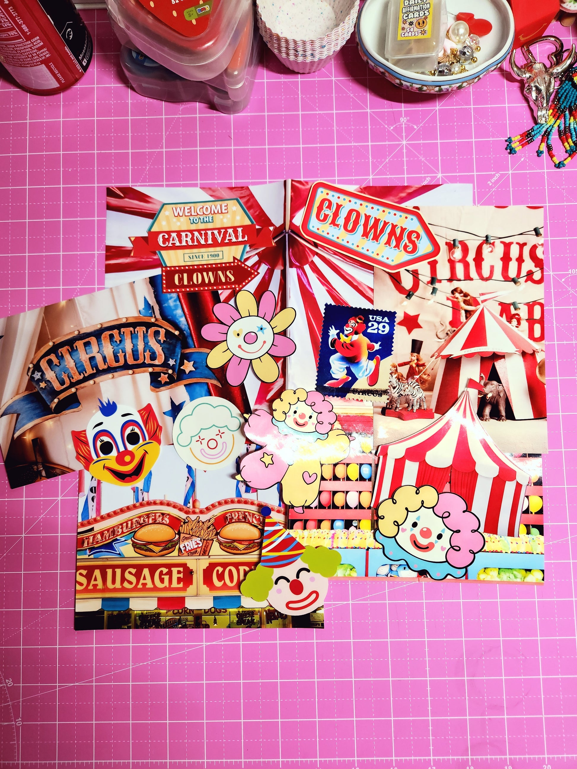 Colorful carnival-themed cutout decorations on a pink cutting mat.