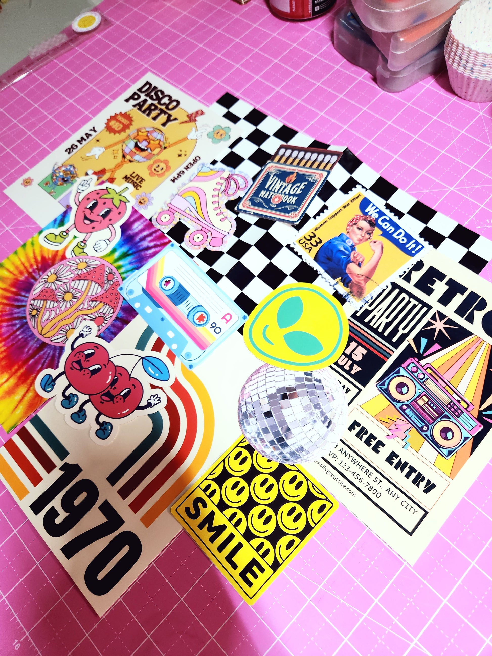 Collection of colorful stickers on a pink grid background