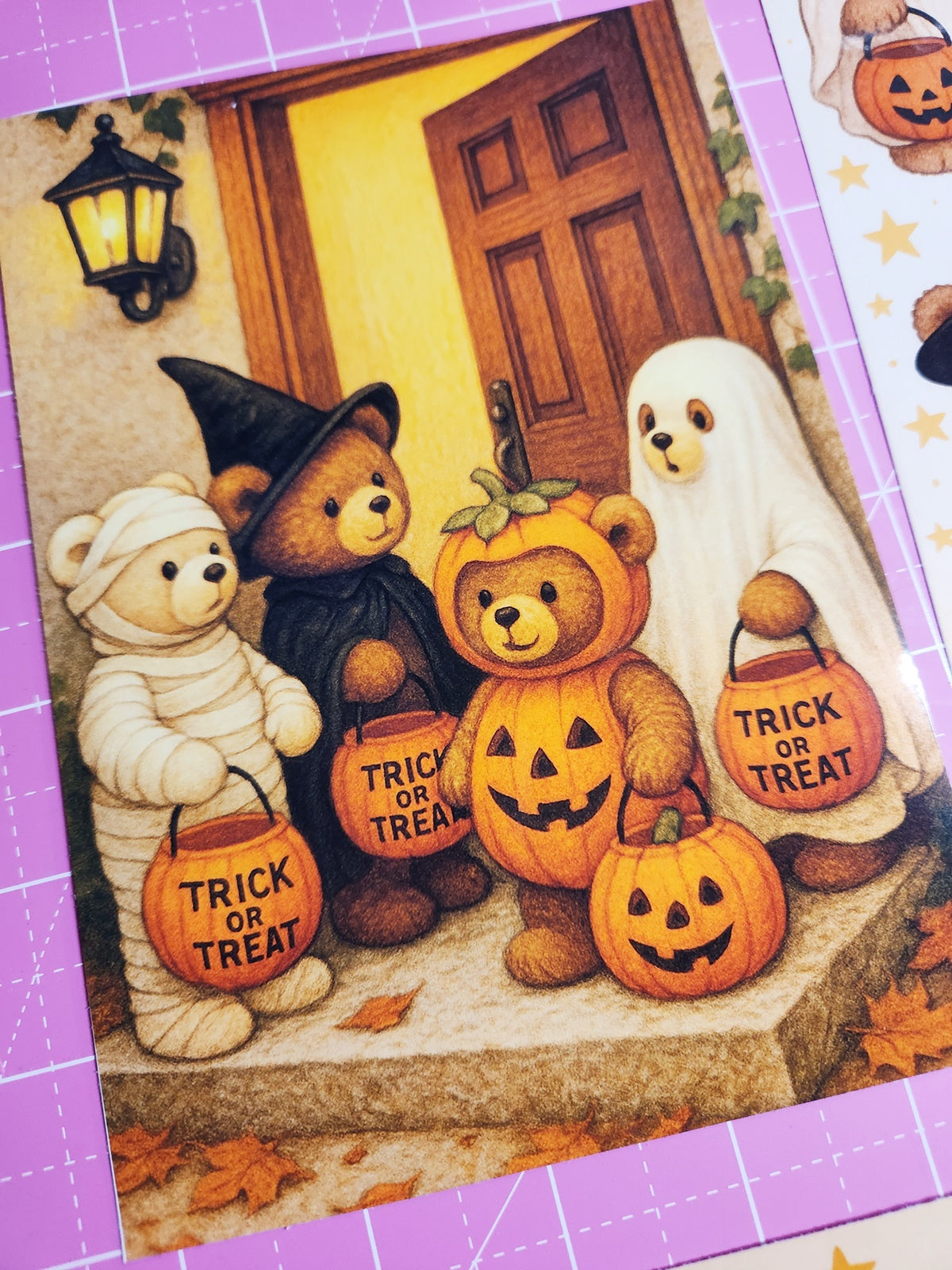 Four teddy bears in Halloween costumes standing in front of a door.