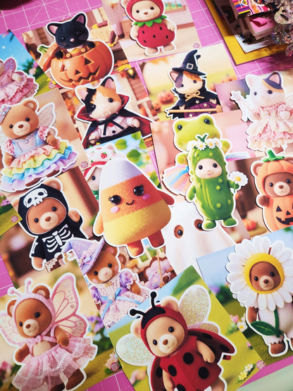 Collection of colorful stickers featuring various animal characters in costumes on a pink grid background.