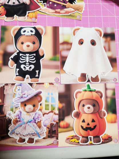Four teddy bears in Halloween costumes on a pink grid background