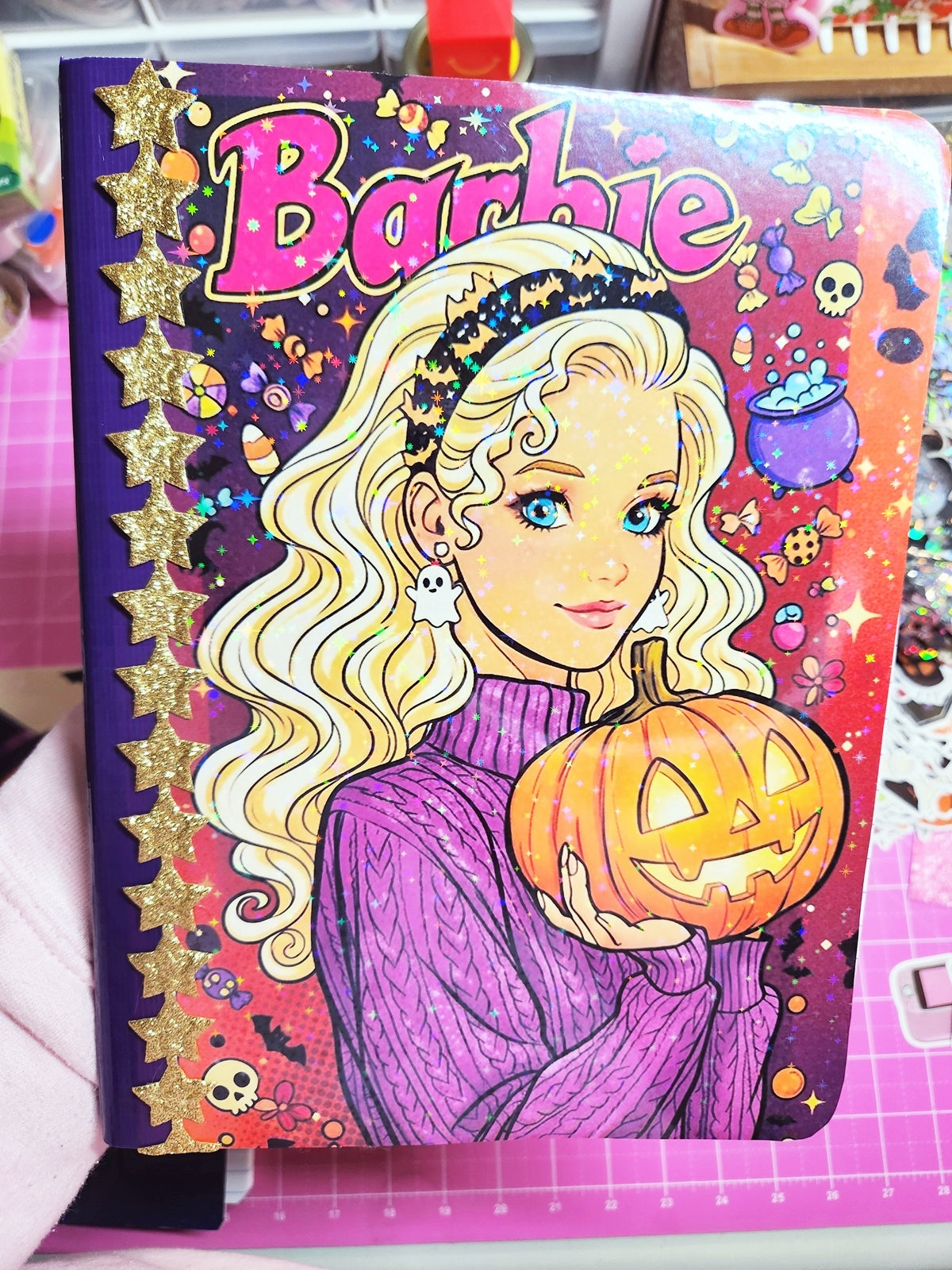 Barbie book with Halloween theme featuring a pumpkin and colorful design.