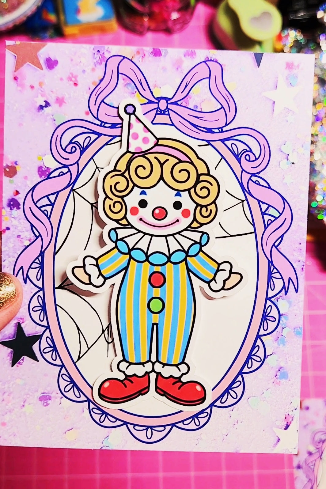 Colorful clown drawing on a pink background with decorative elements