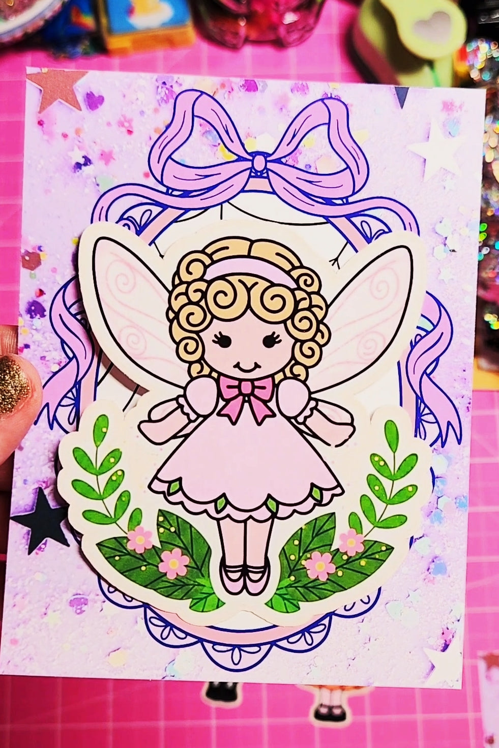 Coloring book page with a fairy illustration on a pink background