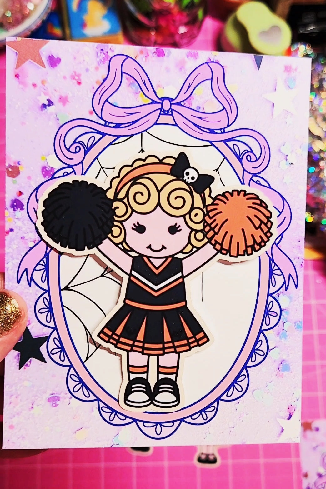 Coloring book page with a cheerleader illustration on a colorful background